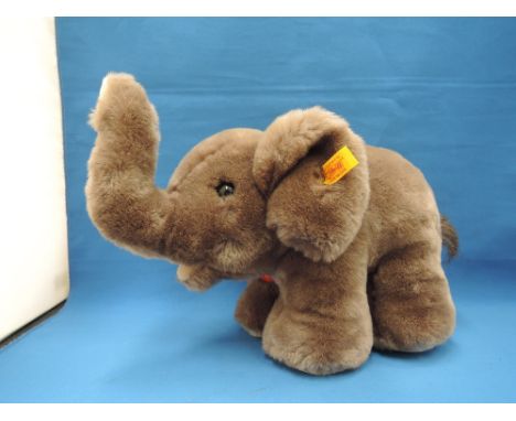 A modern Steife soft toy, elephant, with gold button and yellow tag