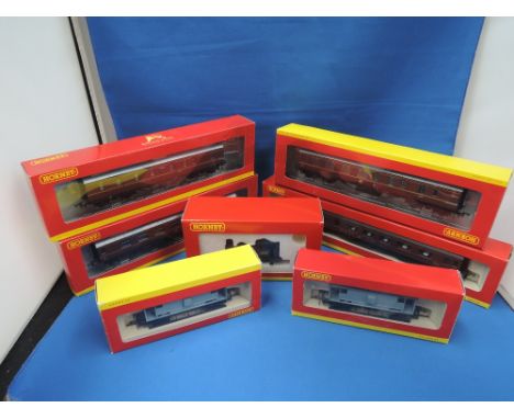 A Hornby 00 gauge 0-4-0 pug tank engine, boxed R2335 and six hornby 00 gauge carriages and wagons, all boxed