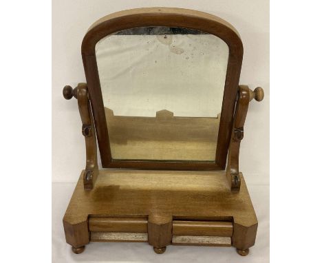 A Victorian dome topped swing mirror with 2 drawers to base. One bun foot missing. Shows signs of sun fading.  Approx. 42cm t