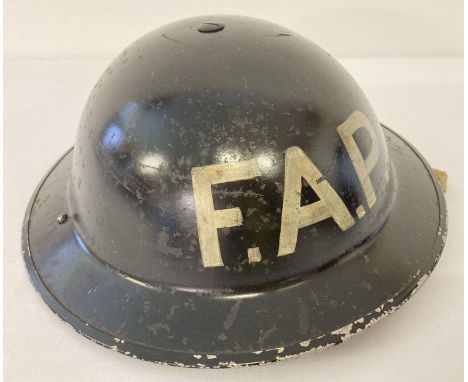 WW2 British MkII steel helmet, painted black for Home Front use, stencilled in white 'FAP'. First Aid Post or First Aid Party