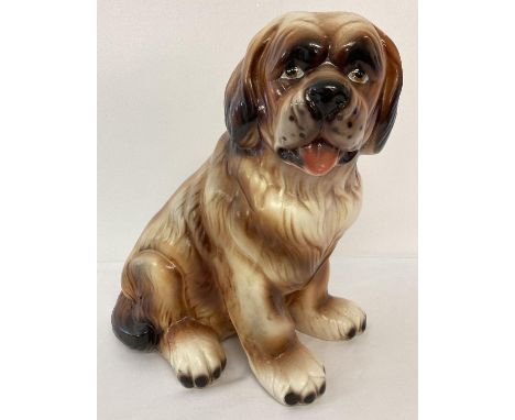 A large ceramic figurine of a Saint Bernard dog. 