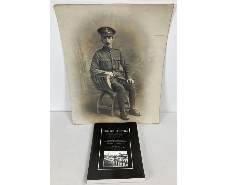 A photographic portrait of a WWI soldier in uniform. Together with a copy of "The Silent Cities; An Illustrated Guide To The 