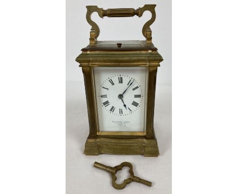 A Goldsmith's Company, 112 Regent Street, London carriage clock. Brass frame with top, side and back glass panels, white enam