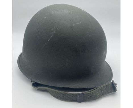 Vietnam War era US Paratrooper M1C steel helmet with helmet shell rim jointed at front. First version WW2 shell refurbished f