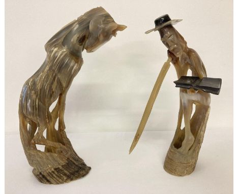 2 vintage carved horn figures, a horse and a man with sword, reading a book. Both approx. 26cm tall. 