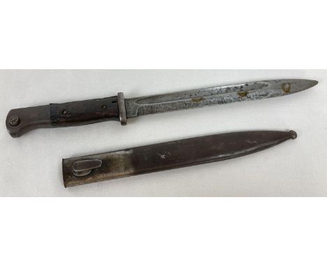 A WWII German wooden grip bayonet with sheath. Marked to blade cof 43 and 4336 r. 