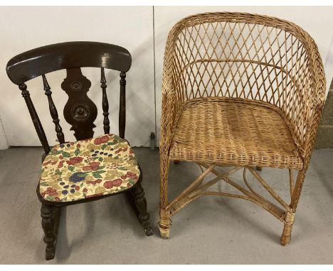 A child's wooden rocking chair with turned and shaped spindle back, painted dark brown. Together with a vintage wicker armcha