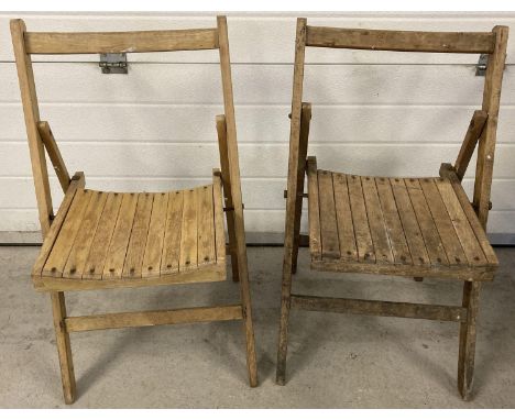 2 vintage folding slat seated wooden chairs. One with Air Ministry mark to underside. 