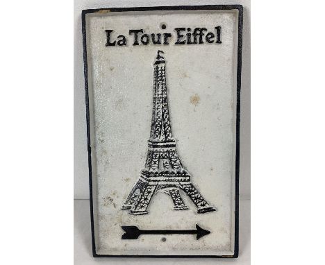 A black and white painted cast iron wall sign with directional arrow for the Eiffel Towel. Approx. 31cm x 19cm. 