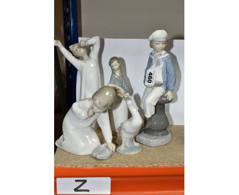 FIVE LLADRO FIGURES, comprising Boy with Yacht model no 4810, sculptor Salvador Furio, issued 1972-1998, height 22.5cm (finge
