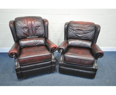 TWO OXBLOOD LEATHER ARMCHAIRS, one chair manual reclining, width of outer arm 91cm (condition:- mechanism working order)