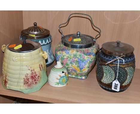 FOUR CERAMIC BISCUIT BARRELS, comprising a Royal Doulton Lambeth Ware barrel decorated with a green circular pattern on a bro