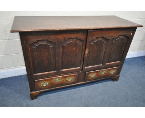 A GEORGIAN OAK CONVERTED MULE CHEST, with a double fielded panel doors over two drawers on bracket feet, width 148cm x depth 