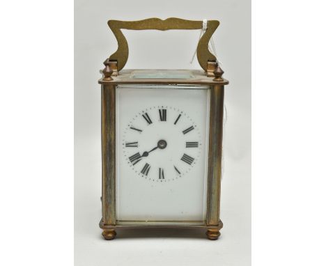 A CARRIAGE CLOCK, white ceramic dial, roman numerals, steel hands (one hand is free from the dial and attached to the inner c