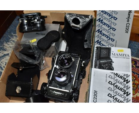 A MAMIYA C220 PROFFESSIONAL F TLR CAMERA with 80mm f2.8 lenses fitted, a set of 65mm f3.5 lenses, manual, case and Prismatic 