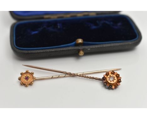 TWO EARLY 20TH CENTURY STICK PINS, the first a yellow metal Etruscan style pin head, centrally set with an old cut diamond, s