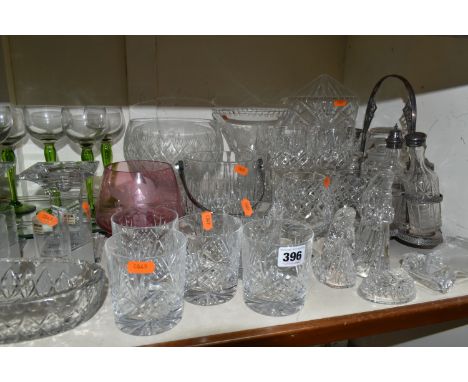 A LARGE QUANTITY OF CUT CRYSTAL AND COLOURED GLASS, comprising a silverplate cruet stand with an assortment of jars and bottl