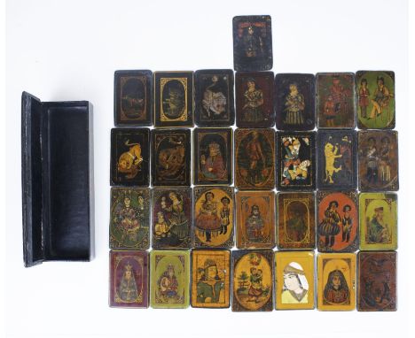 A fascinating Qajar lacquered papier-mache box with playing card. The side of the box is painted with flowers and birds while