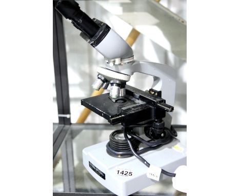 Binocular microscope, by Kyowa Optical, model Unilux, with four lenses. P&amp;P Group 3 (£25+VAT for the first lot and £5+VAT