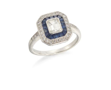 A diamond and sapphire target cluster ring, the rectangular step cut diamond within calibré cut sapphire surround, to outer b