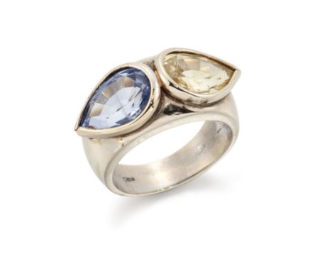 A sapphire and yellow sapphire ring, a pear mixed cut sapphire and yellow sapphire, bezel set to a plain tapering band, stamp