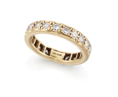 An 18ct gold diamond full eternity ring,&nbsp;with a row of brilliant cut diamonds in cut down settings, London import hallma