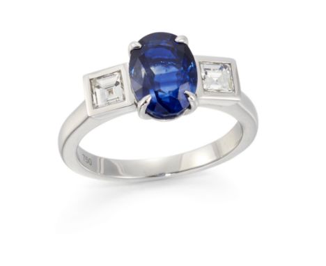 A sapphire and diamond ring, the central oval cut sapphire in claw set mount to princess cut diamond single stone shoulders, 