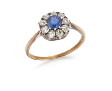 A late 19th century sapphire and diamond cluster ring, the round mixed cut sapphire within old cut diamond surround, all claw
