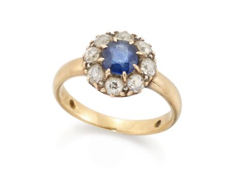 A sapphire and diamond cluster ring,&nbsp;the mixed cut sapphire approximately 5.8 x 5.5 x 2.3mm, within old cut diamond surr