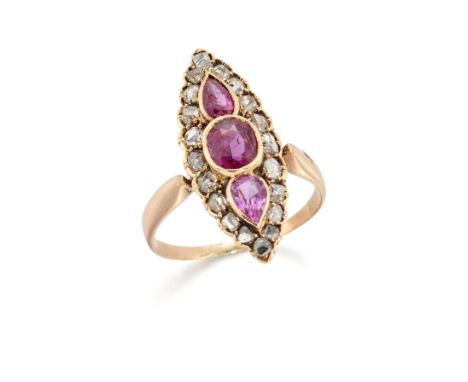 A ruby and diamond navette cluster ring, an oval mixed cut ruby between a pair of pear cut rubies, all millegrain set within 