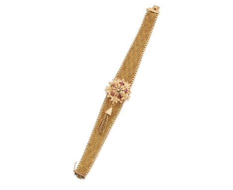 Swiss. An 18ct gold manual wind bracelet watch with concealed dial Circa 1960 17 jewel manual wind movement, silvered dial wi