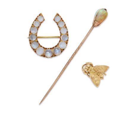A group of late 19th/early 20th century jewellery, comprising: an opal stickpin; a moonstone horseshoe brooch; and a gold fly