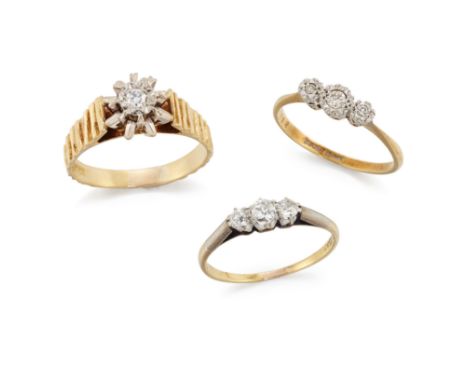 A group of three diamond rings, comprising: an 18ct gold single stone diamond ring with tapering bark textured hoop, Birmingh