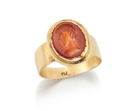 An intaglio carnelian ring,&nbsp;the oval carnelian with intaglio engraved profile, bezel set to a flat section tapering hoop