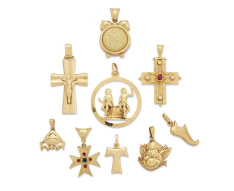 A group of charms and pendants, comprising: a ruby and diamond set cross pendant, stamped 750; an Italian crucifix pendant, s