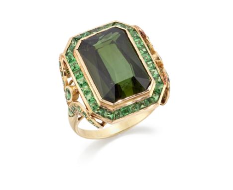 A tourmaline and tzavorite garnet ring, the collet-set mixed rectangular-cut green tourmaline with calibré tzavorite garnet b
