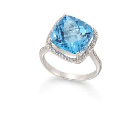 A blue topaz and diamond ring, the cushion chequer cut blue topaz within brilliant cut diamond surround, to crossover brillia
