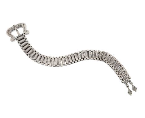 A Victorian silver flexible bracelet, of broad panel link design to a stylised buckle clasp with foliate engraved decoration,