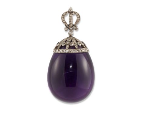 A late 19th/early 20th century amethyst and diamond pendant, the egg shaped polished amethyst drop to an openwork cusp the fr