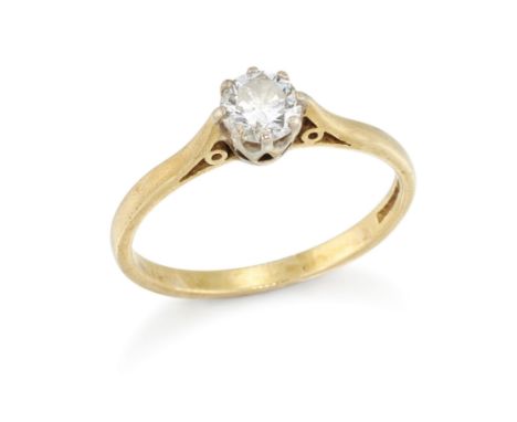An 18ct gold diamond single stone ring, the claw set brilliant cut diamond to a plain hoop, Birmingham hallmarks, 1990, ring 