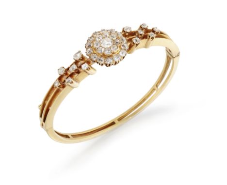 A late 19th century diamond cluster bangle, a central three row old cut diamond cluster to three row knife edge upper half cl