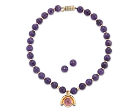 Bulgari. A pink tourmaline and sapphire pendant, the collet set cabochon pink tourmaline to arched surmount with sapphire cab