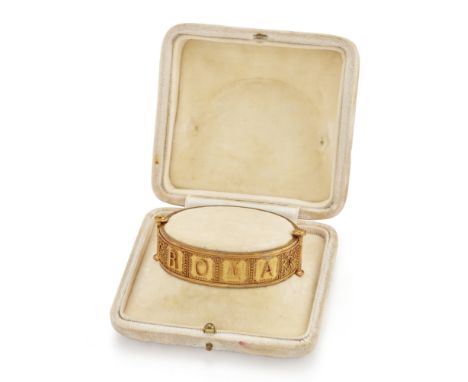 A Victorian gold Archaeological Revival bangle, of hinged design, with Etruscan style wire and bead decoration and the applie