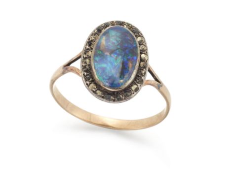 A black opal and marcasite cluster ring, the oval collet-set black opal within marcasite border to a plain hoop, ring size N½