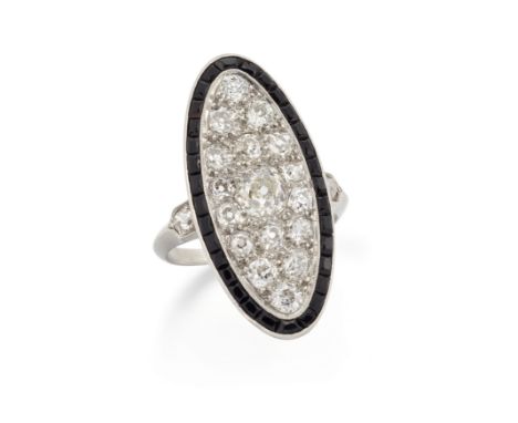 A diamond and onyx ring, of oval plaque design, with pavé set old cut diamonds within a step cut onyx border, to diamond set 