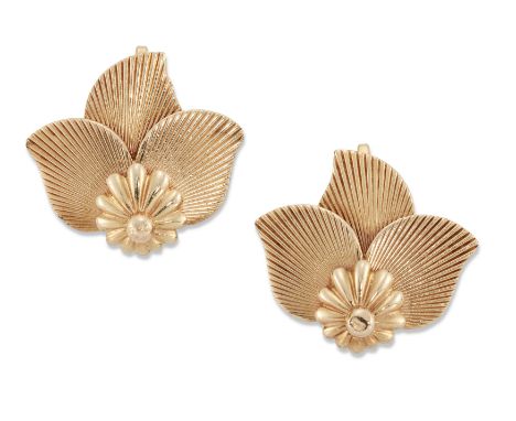 Cartier. A pair of 'lotus' clip earrings, each of engine-turned trefoil petal design with stylised flowerhead base, each sign