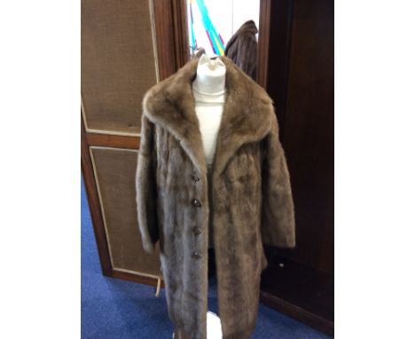 Long Light Brown Mink Coat Ladies Mink coat in good condition, wave design grey jacquard lining with internal tie fastening a