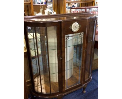 China Display Cabinet, bow fronted with Smiths circular clock to the front. c 1930's.