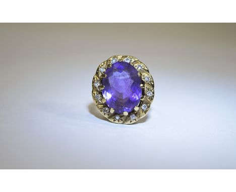 14ct Gold Set Nice Quality Amethyst and Diamond Cluster Ring. The Central Amethyst ( Of Good Colour ) Surrounded by 14 Diamon