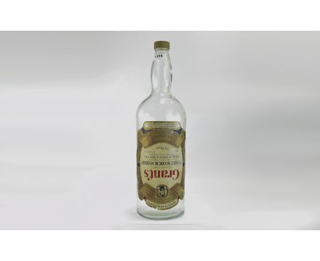 A Huge Grants Scotch Whisky 4.54 Litre Bottle. 19.75 Inches High. 